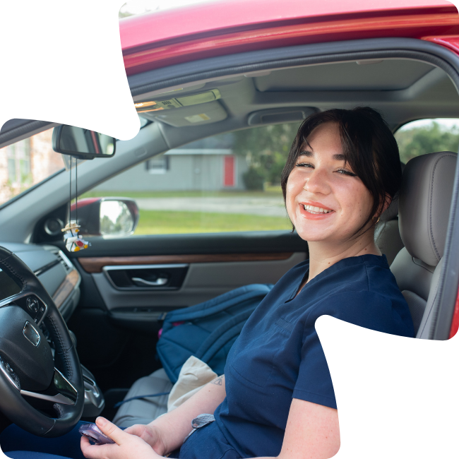 happy nurse in her car
