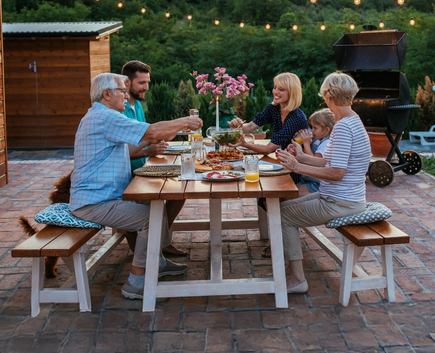 family at picnic table on patio