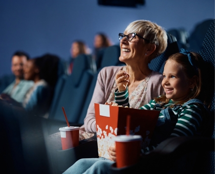 grandma and granddaughter at movies