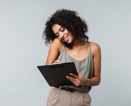 woman on phone and laptop