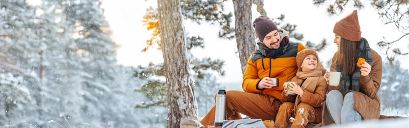 family outside in snow