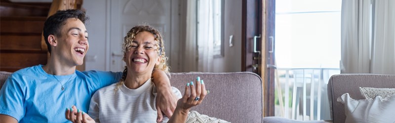 mom and son sitting on couch