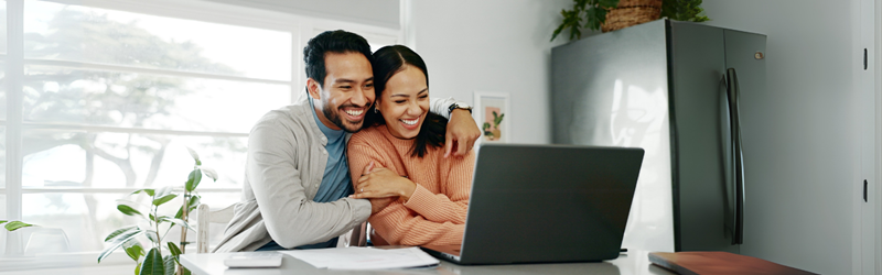 happy couple on computer
