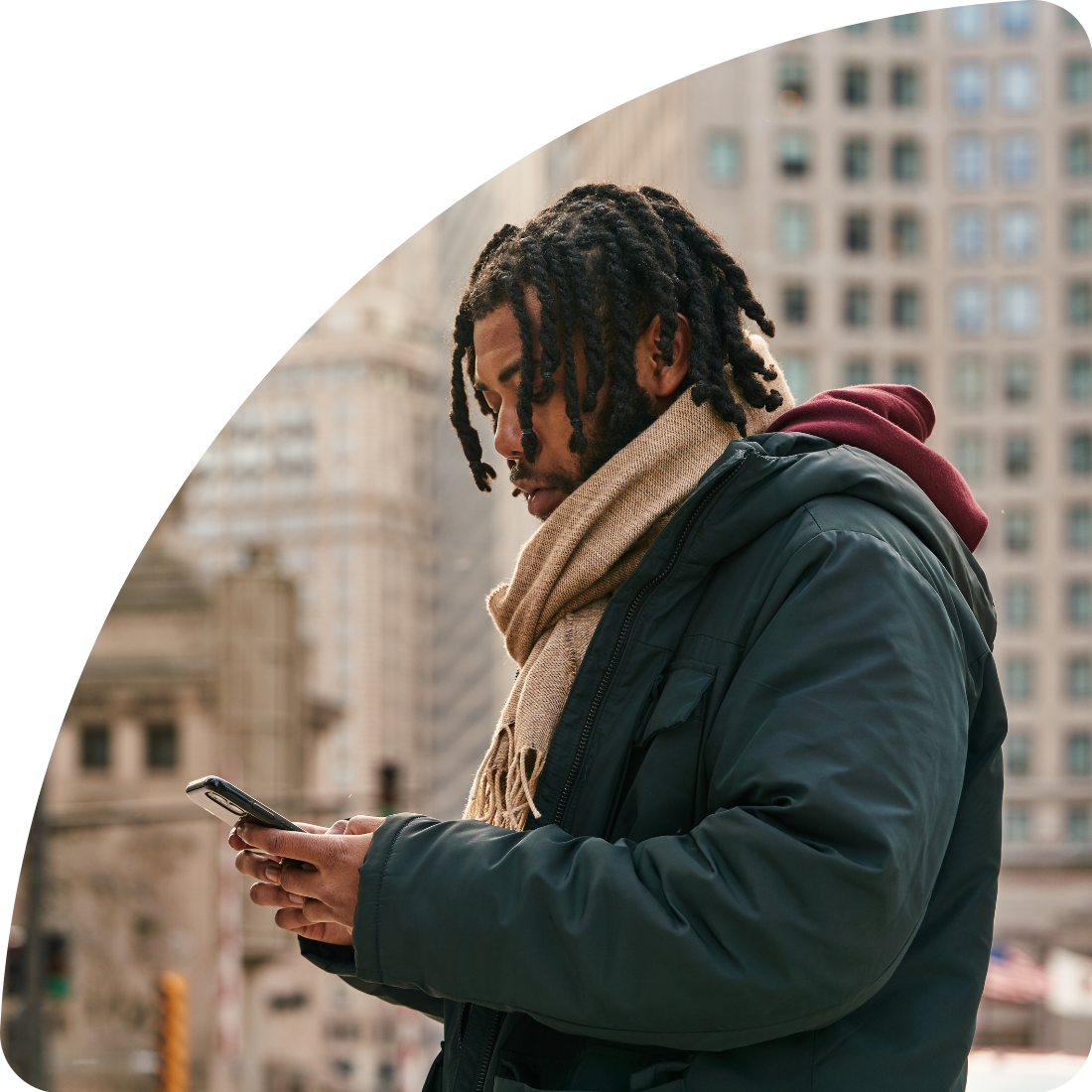 Young man on phone in city