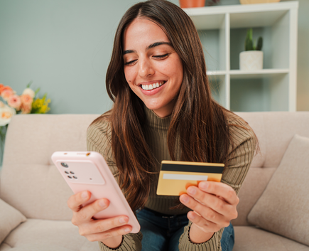 woman on phone with credit card