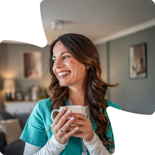 nurse smiling with coffee